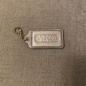 Coach Metallic Silver Tag